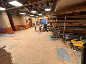 The lobby area as a construction office with construction materials stacked floor to ceiling.