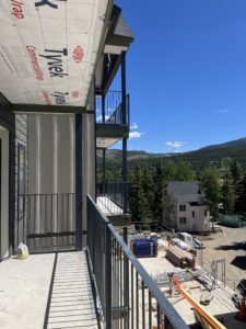 View to the future location of the hot tubs and fire pit as well as the lower townhomes from one of the balconies of the Tower building.