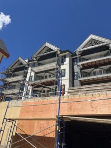 With the scaffolding off of the Tower building, the new siding, balcony railings, new windows and doors, and fresh accent paint really pop!