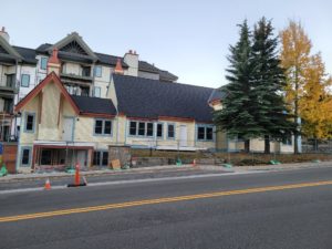 Painting in progress along the front townhomes